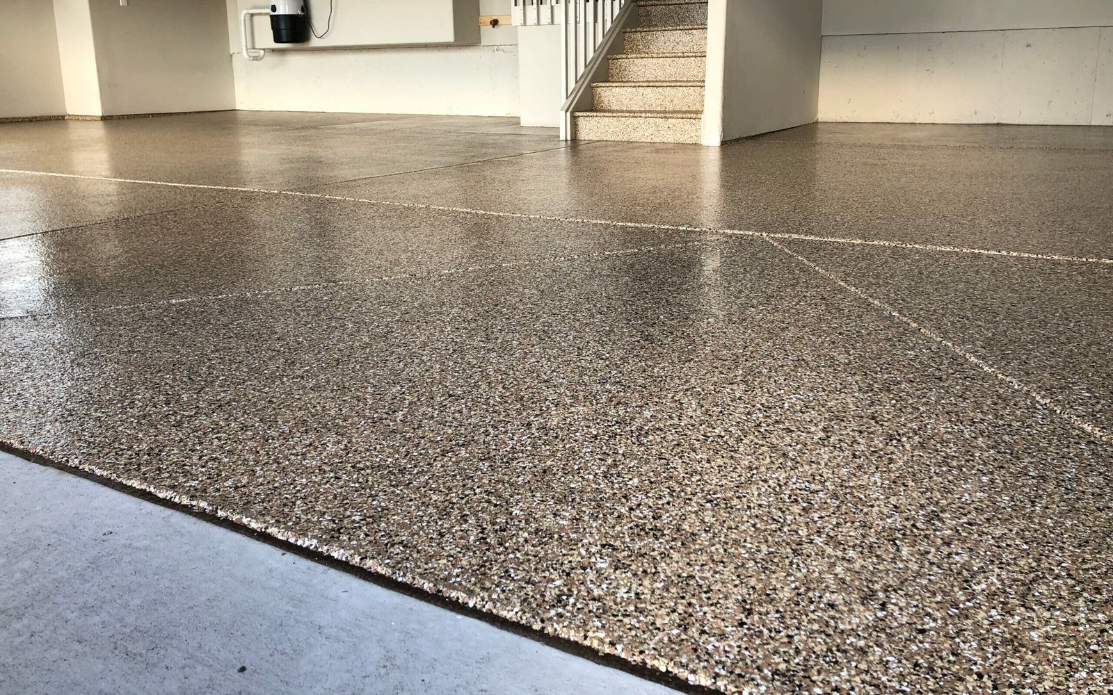 What is the benefit of a coated garage floor?